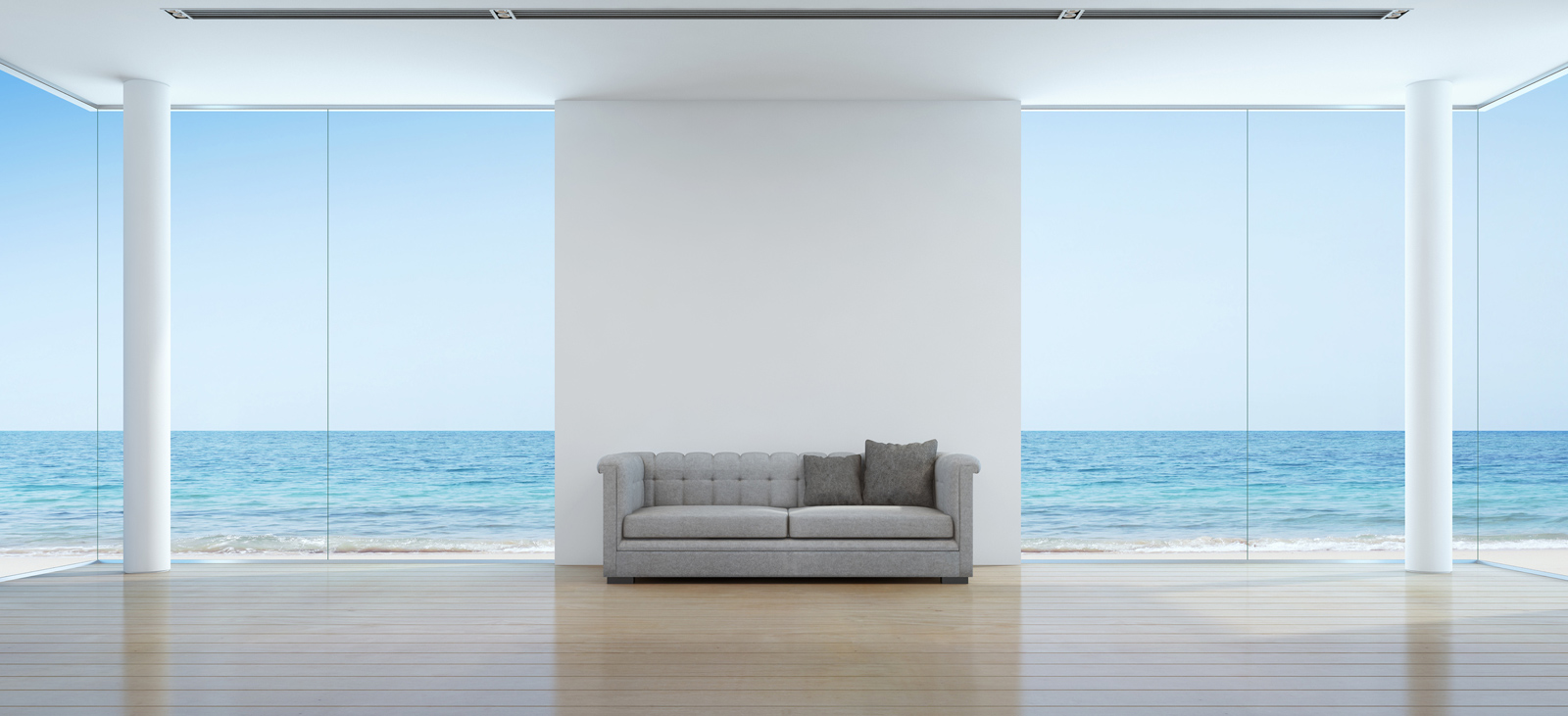 Sofa in the middle of a luxury living room surrounded by water